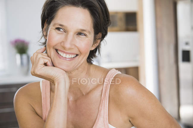 Portrait of smiling mature woman with short hair — Stock Photo