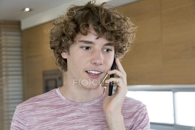 Teenage boy talking on mobile phone — Stock Photo