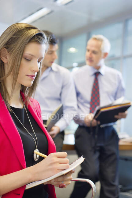 Business executives working in an office — Stock Photo