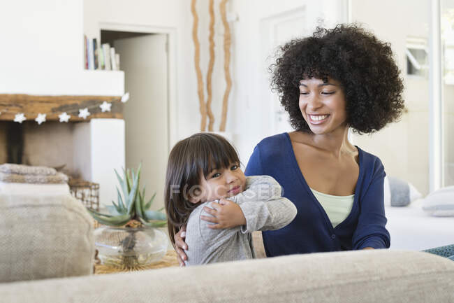 Woman smiling at her daughter — Stock Photo