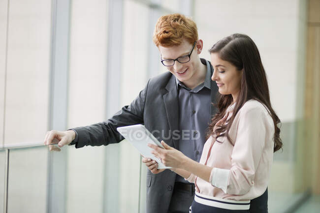 Business executives using a digital tablet in an office — Stock Photo