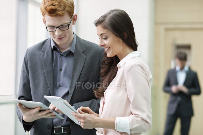 Business executives using digital tablets in an office — Stock Photo