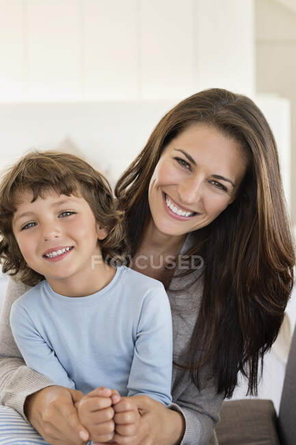 Portrait of a woman and her son smiling — Stock Photo