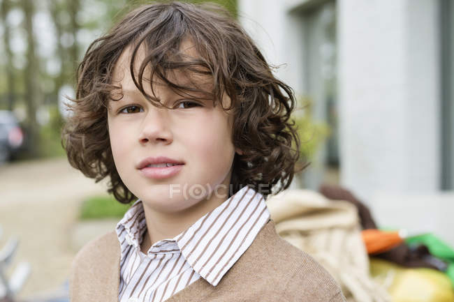 Portrait of curious boy standing outdoors — Stock Photo