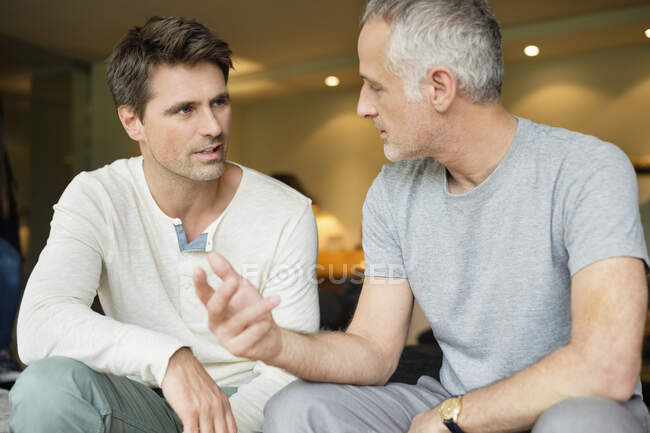 Two male friends discussing — Stock Photo