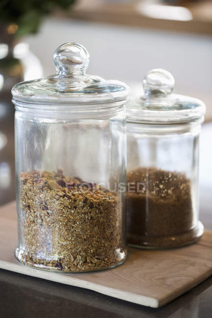 Food in jars at kitchen counter, selective focus — Stock Photo