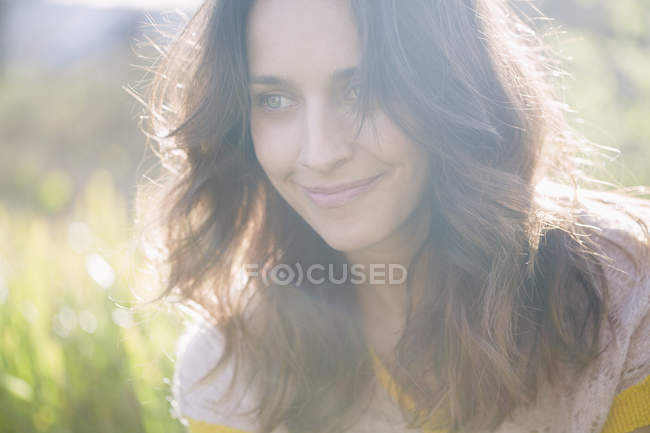 Close-up of thoughtful natural woman posing in garden — Stock Photo