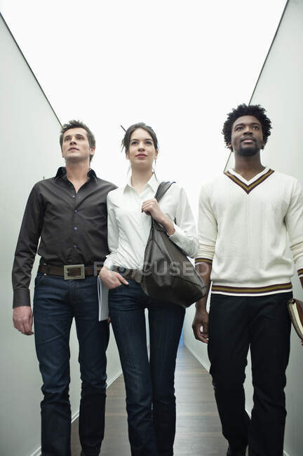 Business executives walking in the corridor of an office — Stock Photo