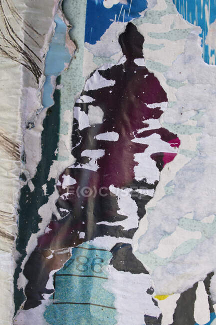 Close-up on torn posters. — Stock Photo