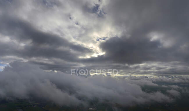 France, flying between two layers of clouds above the Vendee countryside — Stock Photo