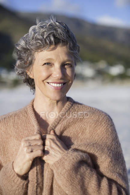 Portrait of smiling mature woman outdoors — Stock Photo