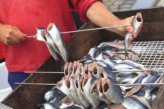 Closeup of Man preparing herrings — Stock Photo