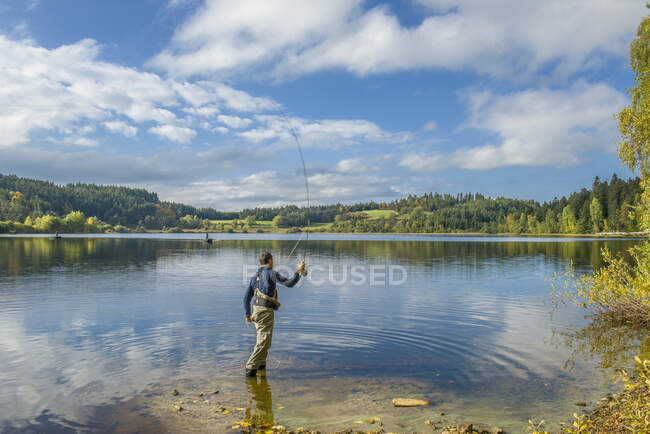 France, Auvergne, Fly fishing on Malaguet Lake. — Stock Photo
