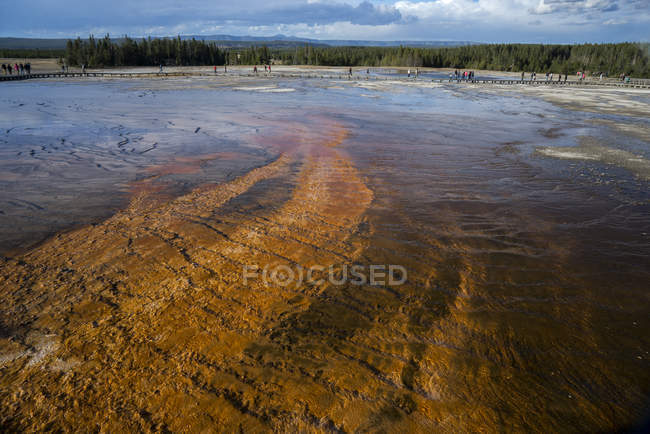 Grand Prismatic Spring with view to Twin Buttes, Midway Geyser Basin, Yellowstone National Park, UNESCO World Heritage Site, Wyoming, United States of America, North America — стоковое фото
