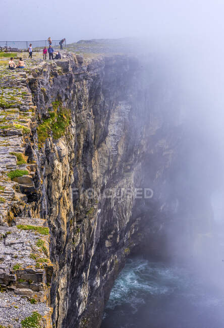 Europe, Republic of Ireland, County Galway, Aran Islands, Inishmore Island, cliffs dug by the sea near the Dun Aengus prehistorical Ringfort site (Aonghasa) (1100 BC - 800 AC) — Stock Photo