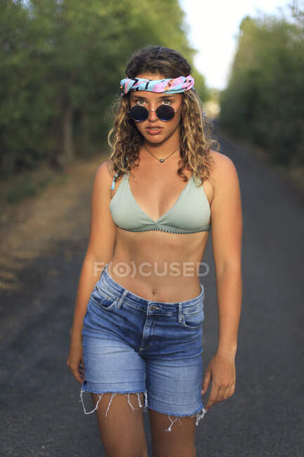 Young and Pretty Hippie on a Deserted Road — Stock Photo