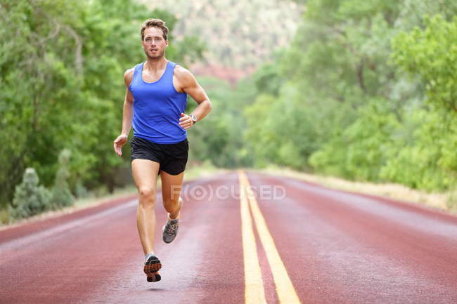 Courir athlète homme — Photo de stock