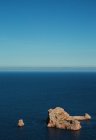 Blue view, photo of a lonly rock in Ibiza — Stock Photo