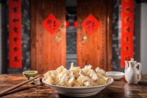 Traditional Chinese dumplings on table served for Chinese New Year. — Stock Photo