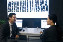Professional business people working together in the control room — Stock Photo