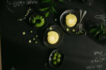 Top view of delicious healthy breakfast on black table — Stock Photo