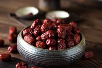 Close-up view of red healthy jujube berries on wooden table — Stock Photo