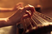 Cropped shot of woman playing traditional ancient chinese string instrument — Stock Photo