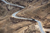 Aerial view of winding Sichuan-Tibet highway in mountains — Stock Photo