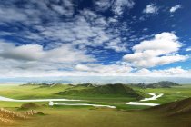 Beautiful landscape with mountains and Bayinbuluke grassland in Xinjiang, China — Stock Photo