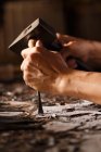 Cropped shot of man during woodworking engraving, traditional chinese art and craft — Stock Photo