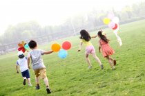 Children playing in field — Stock Photo