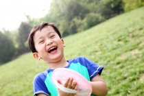 Portrait of boy playing outdoors — Stock Photo