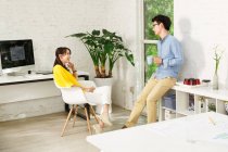 Young man and young woman in design studio — Stock Photo