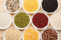 Top view of various kinds of grains on the plates — Stock Photo