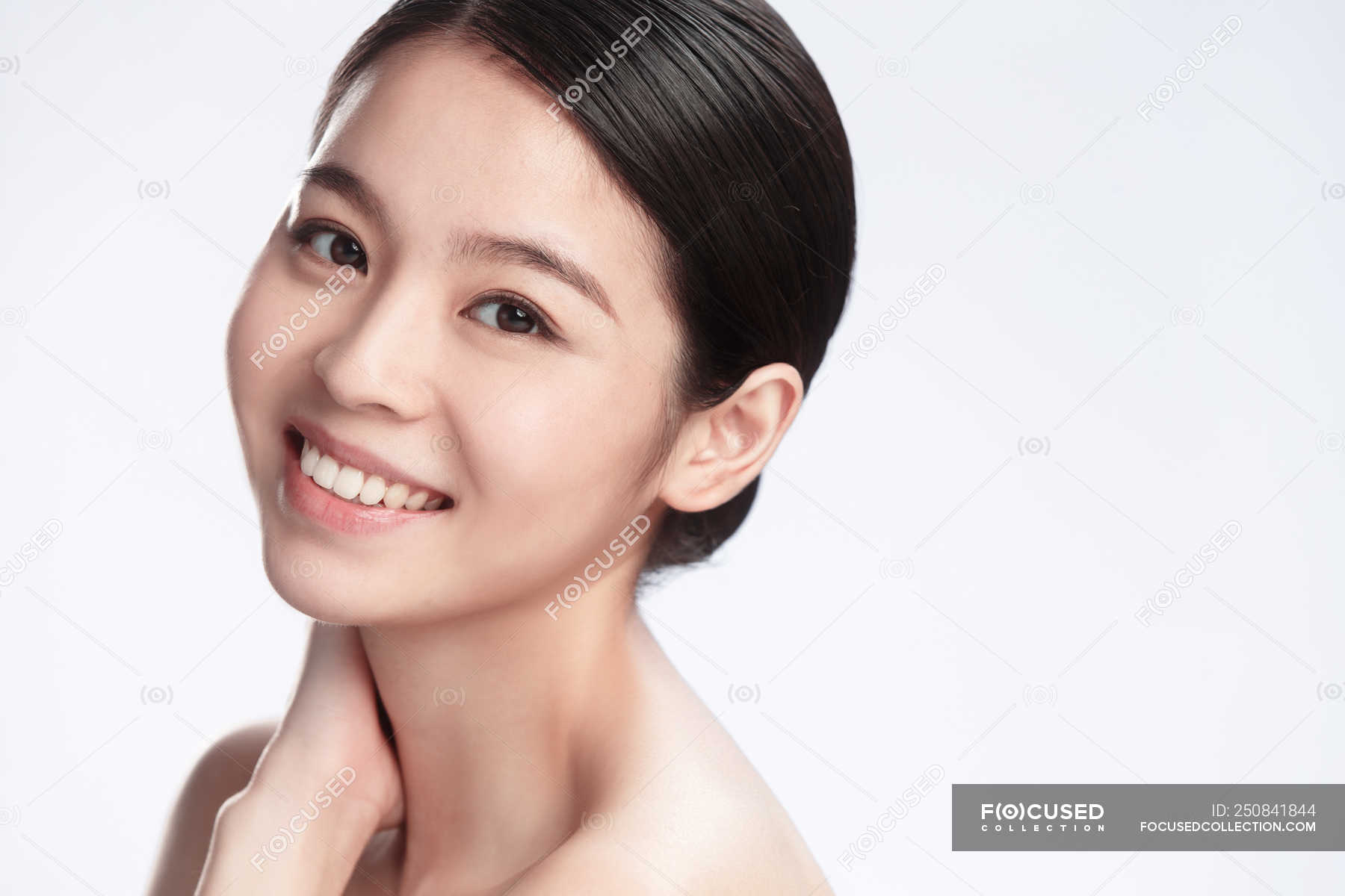 Portrait Of Elegant Happy Young Asian Woman Smiling At Camera Isolated On Grey Background — Copy 