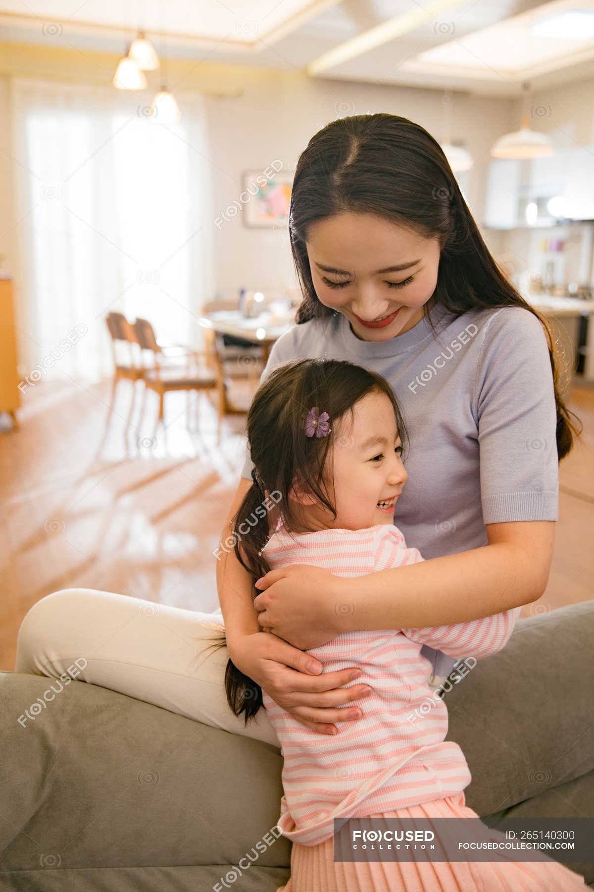 Beautiful Happy Asian Mother And Daughter Hugging At Home — Together