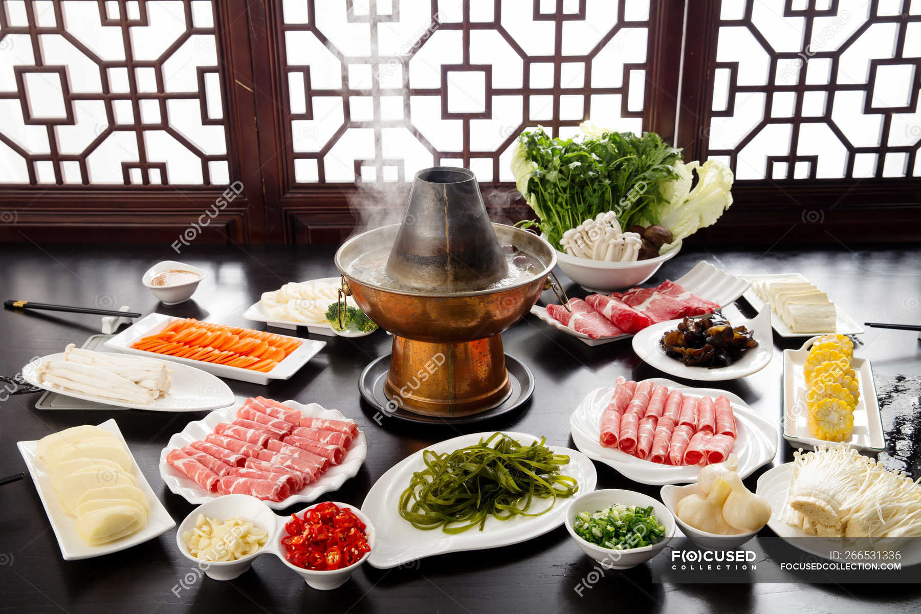 antenna impact Ringlet Copper hot pot with meat and vegetables on table, chafing dish concept —  East Asian Culture, red meat - Stock Photo | #266531336
