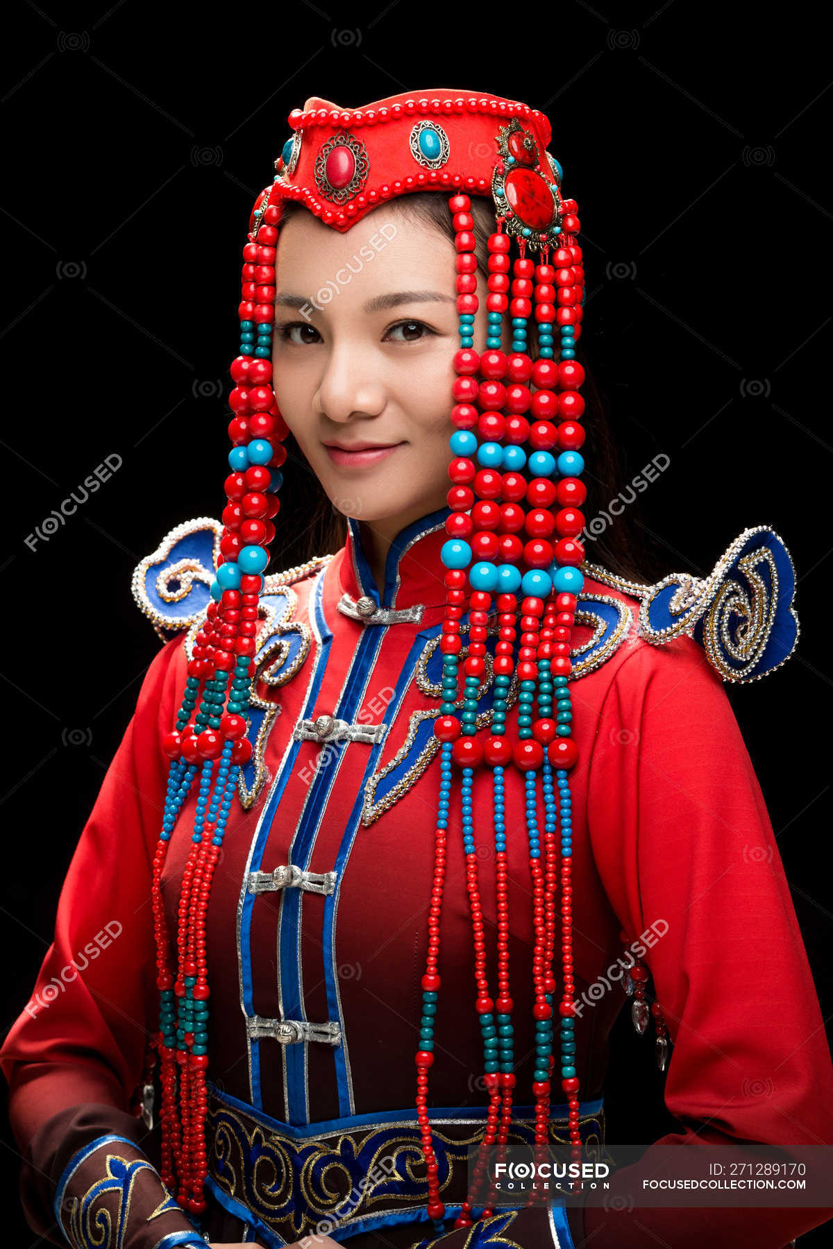 Beautiful young woman in the Mongolian costume looking at camera — one  young woman only, mongolian ethnicity - Stock Photo | #271289170