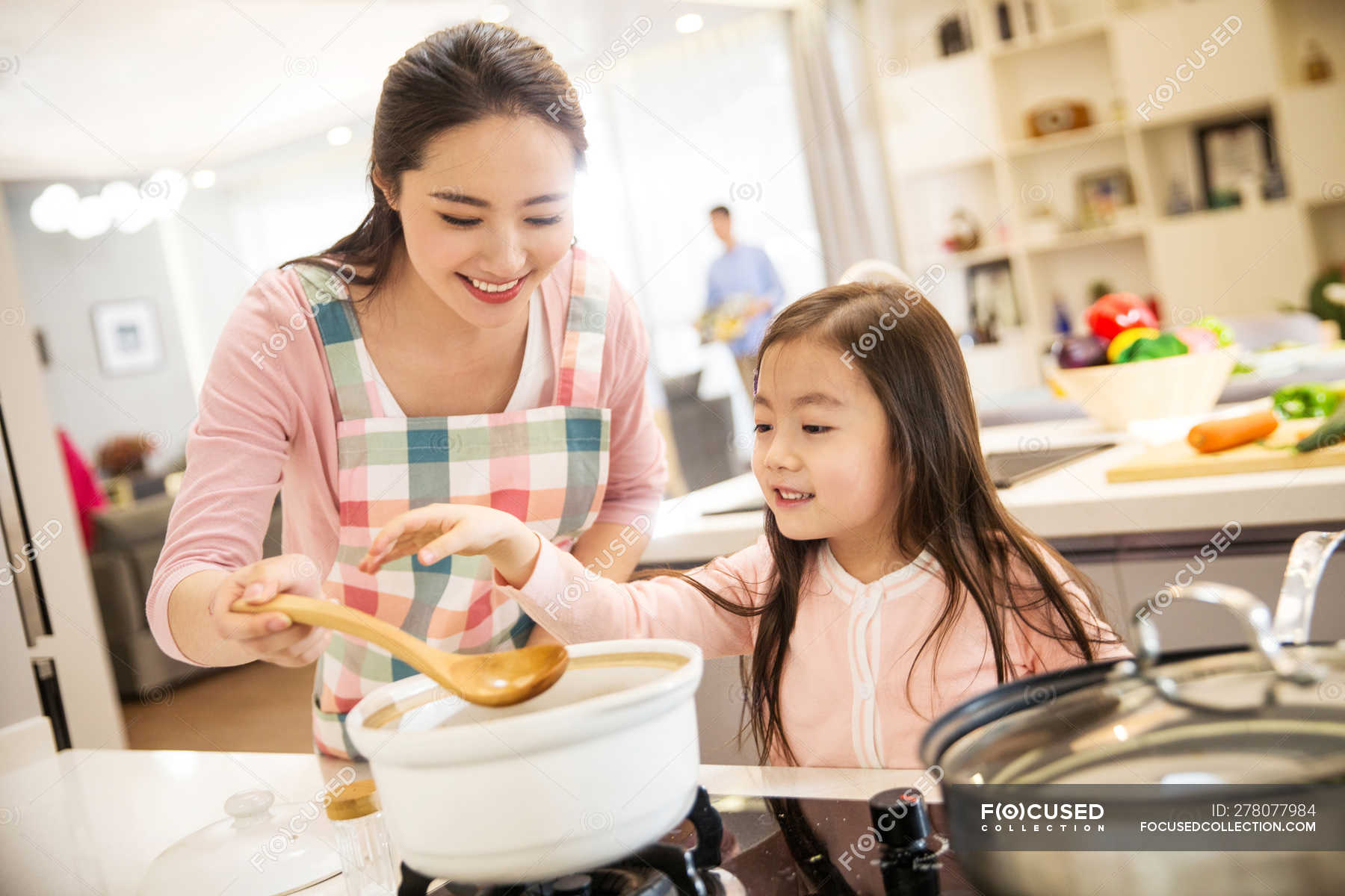 Happy Asian Mother And Daughter Cooking Together In Kitchen — Woman