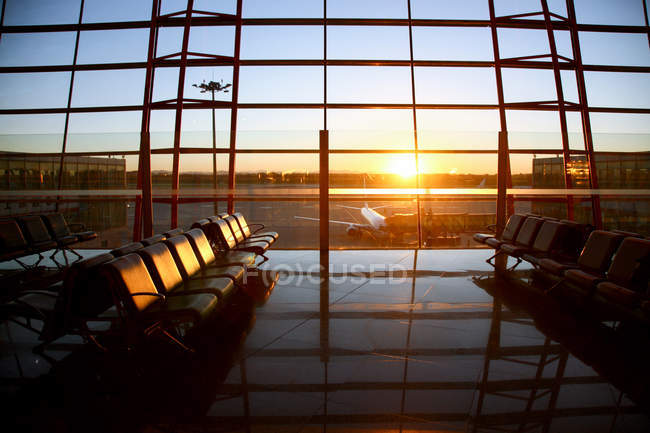 Inside of empty modern airport lounge during sunset — Stock Photo