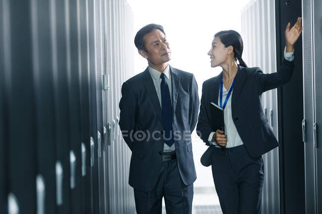 Technical personnel discussing while working in the maintenance room inspection — Stock Photo