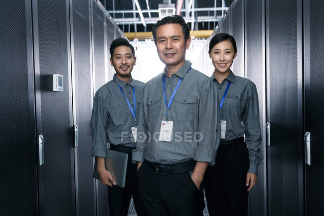 Professional coworkers working in the maintenance room inspection — Stock Photo