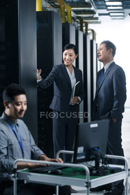Professional coworkers working in the maintenance room inspection — Stock Photo