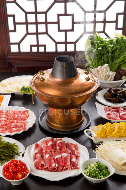 Curiosity Respect pupil Copper hot pot, meat and vegetables on table, chafing dish concept — still  life, mushrooms - Stock Photo | #266534530
