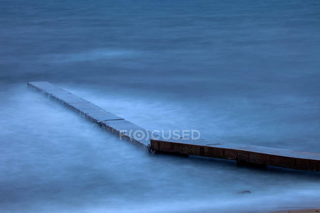 High angle view of pier and wavy sea at Beidaihe, Hebei, China — Stock Photo