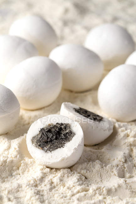 Close-up view of delicious glutinous rice balls with filling in flour — Stock Photo