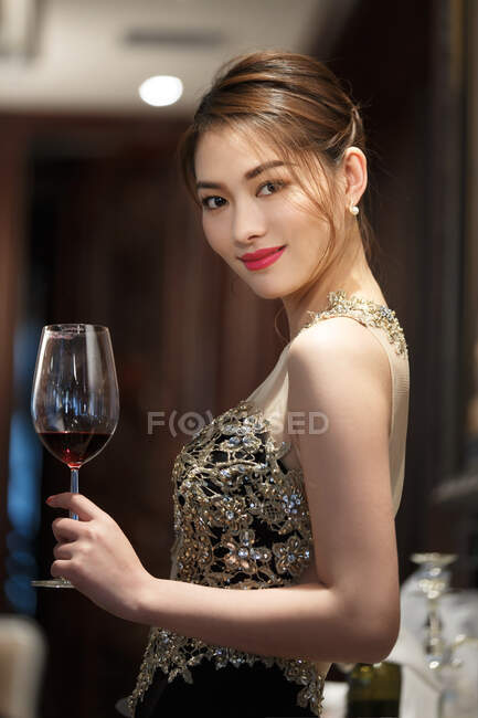 A beautiful young woman holding goblet — Stock Photo
