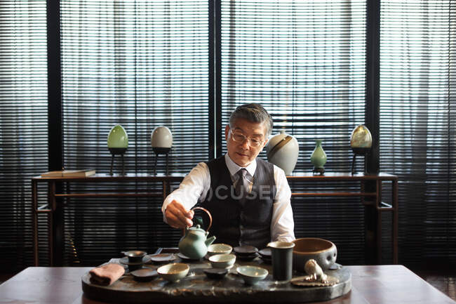 Middle aged and old men drink tea — Stock Photo