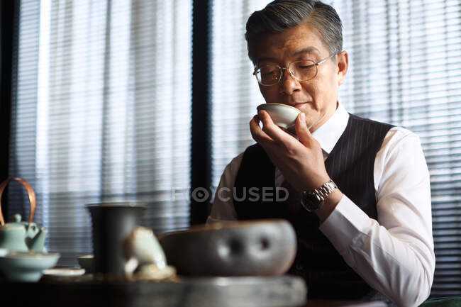 Middle aged and old men drink tea — Stock Photo