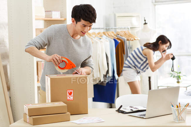 Young man and young woman in design studio — Stock Photo